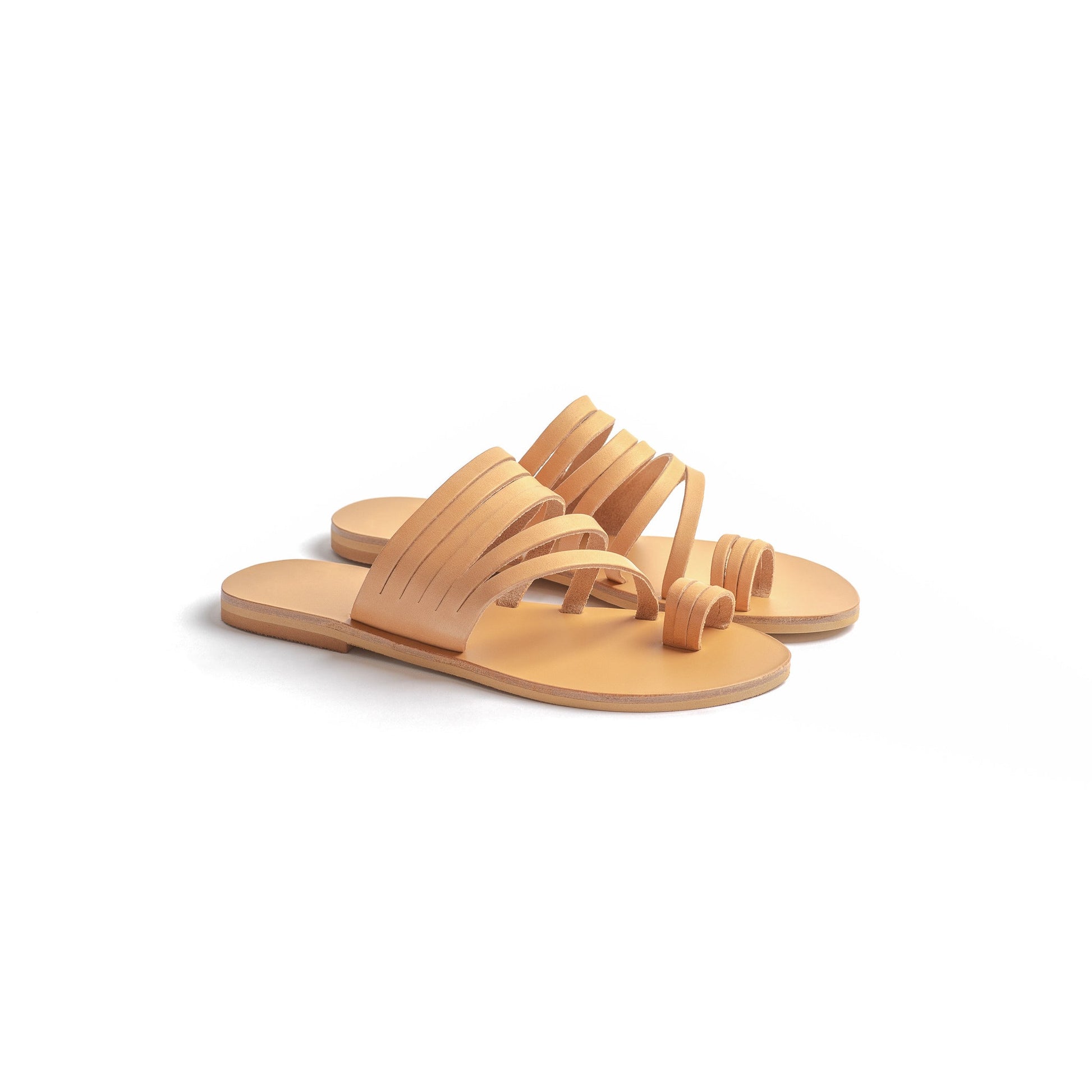 Helen slide on flats in tan leather against a white background. They are slip on flats womens.