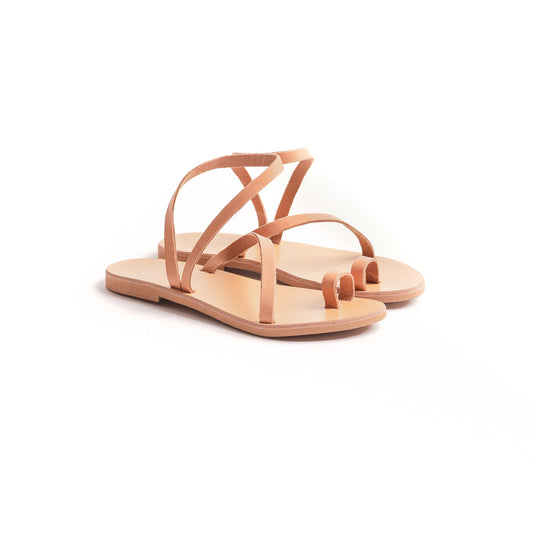 Pair of tan flats sandals against a white background. They are cute flats for women.
